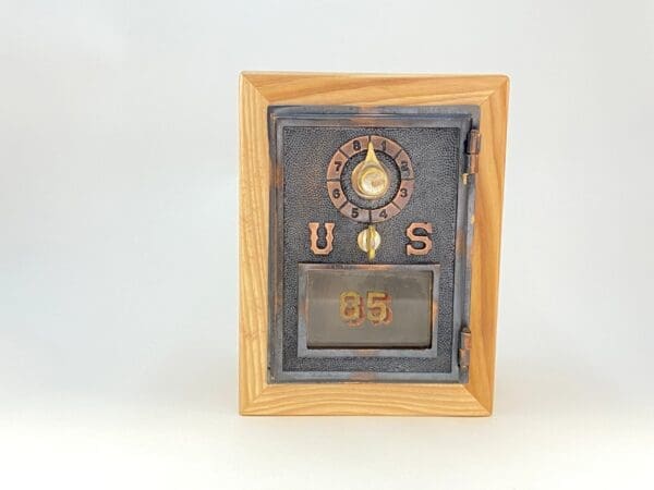 A picture frame with an old time clock on it.