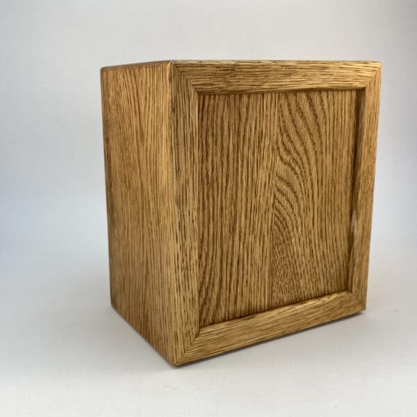 Wooden box with a rectangular design.