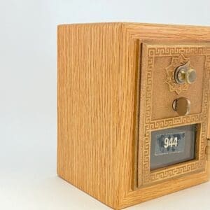 A wooden safe with the door open.