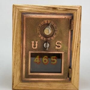 A wooden frame with a clock and numbers on it.