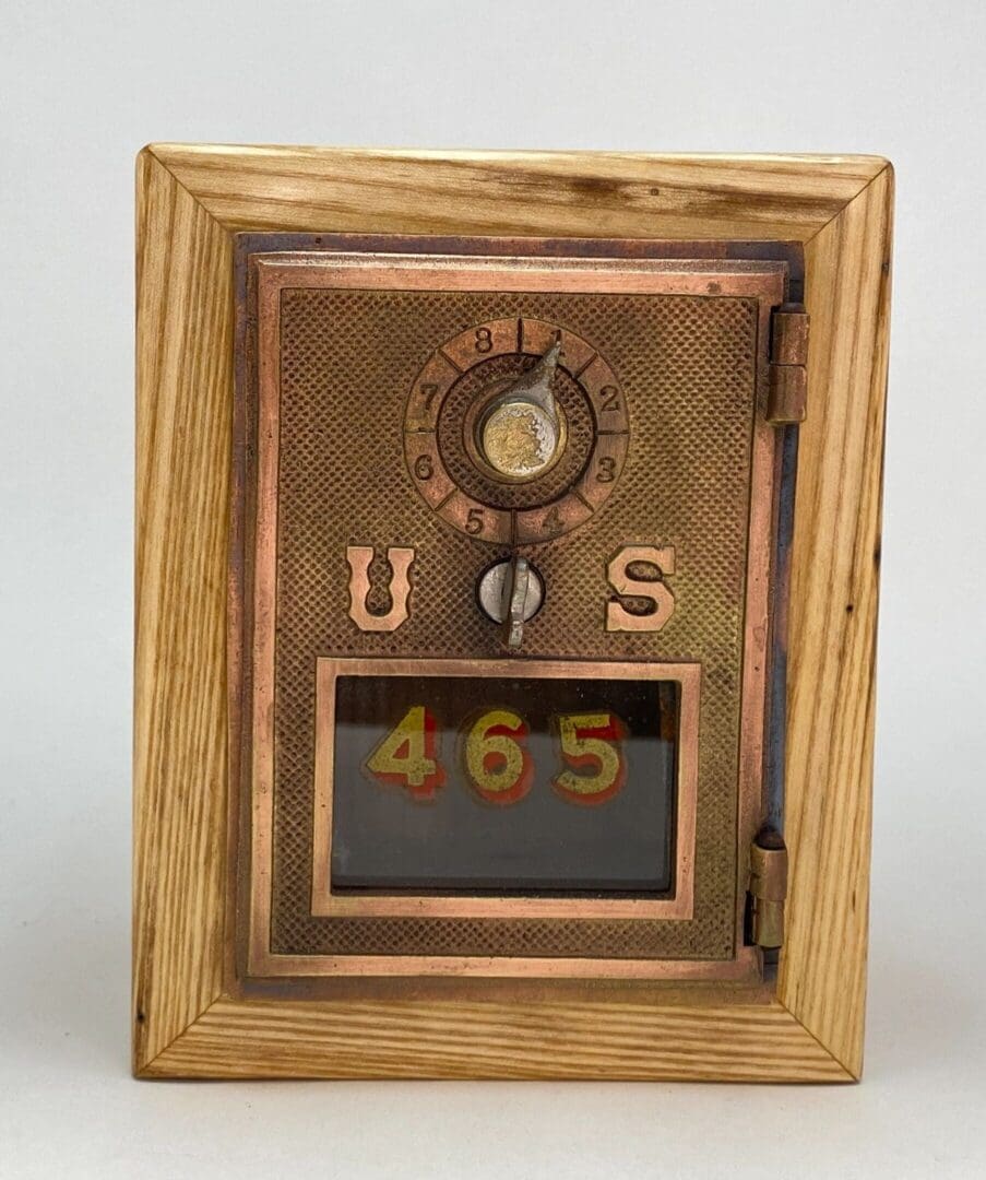 A wooden frame with a clock and numbers on it.