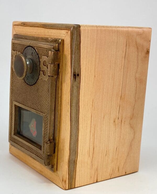 A wooden box with a picture on the side.