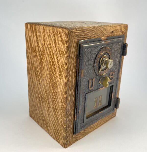 Vintage wooden safe with combination lock.