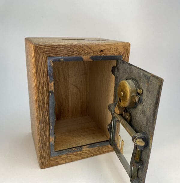 Wooden box with metal lock mechanism.