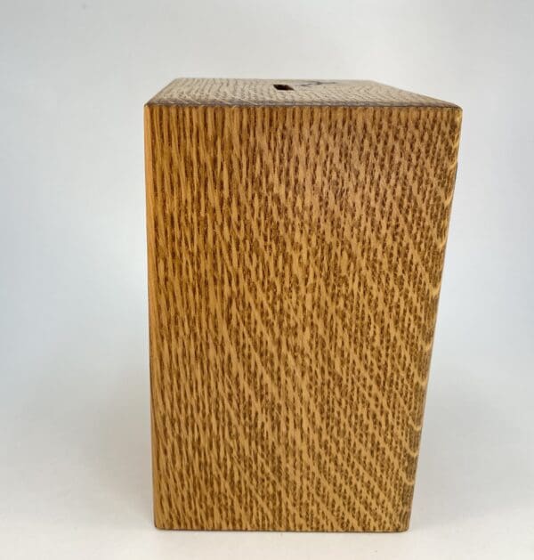 Wooden box with a textured surface.