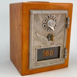 A small wooden box with a clock and numbers on it.