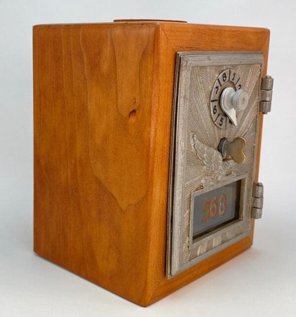 A wooden box with a heart on the front of it.