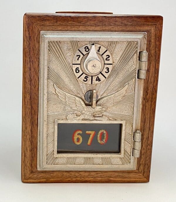 A clock is shown in the middle of a wooden frame.