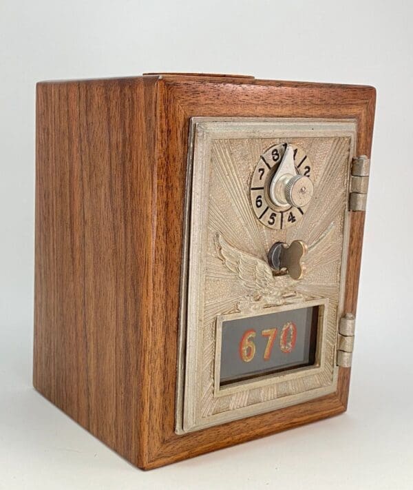 A wooden box with a clock and numbers on it.