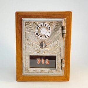 A wooden box with a metal door and a picture of marijuana leaves.