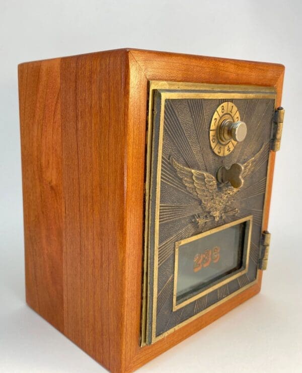 A wooden box with an eagle on the front.