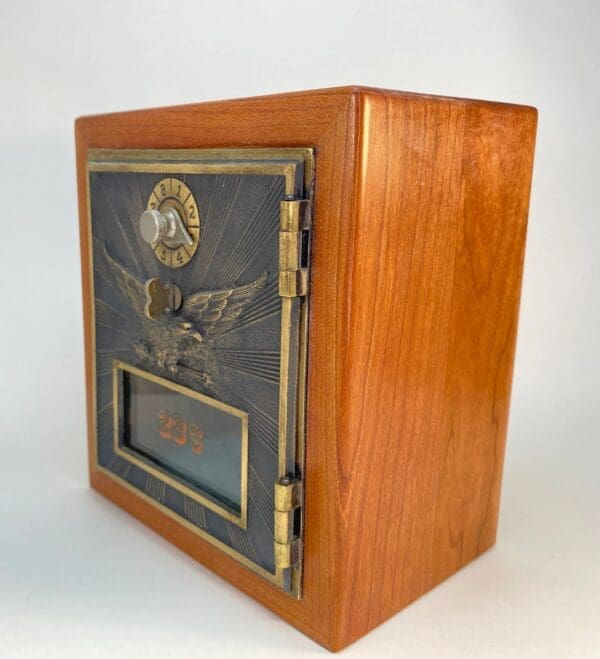 A wooden box with an eagle on the front.