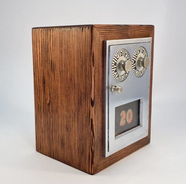 Wooden box with metal door and dials.