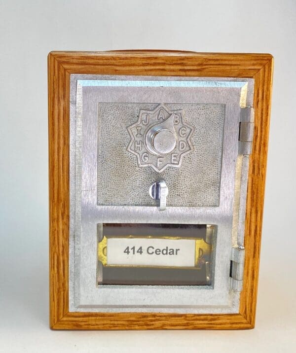 A picture frame with a plaque and a key.