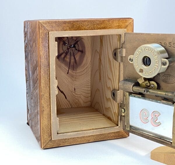 Wooden box with a metal lock and key.