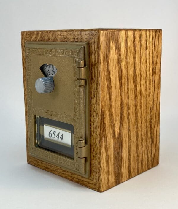 Antique wooden mailbox with number 6544.