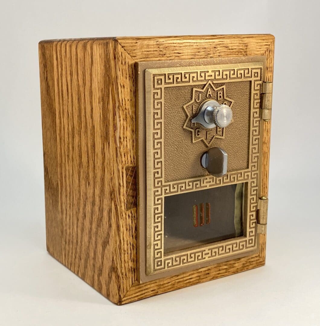 Vintage wooden mailbox with brass door.