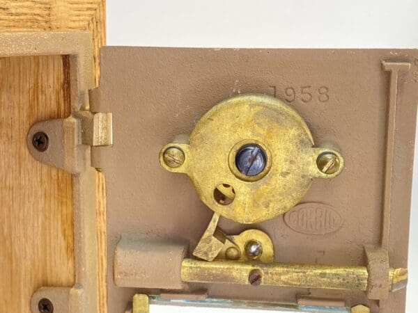 Vintage 1958 brass door lock mechanism.