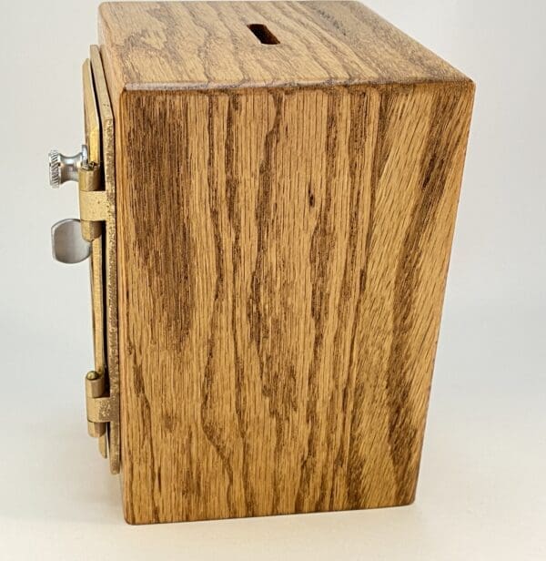 Wooden box with a brass latch.