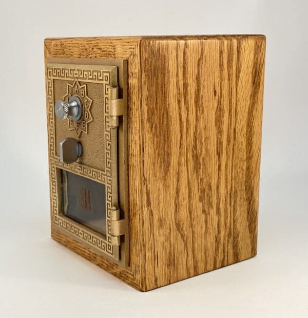 Antique wooden mailbox with ornate details.