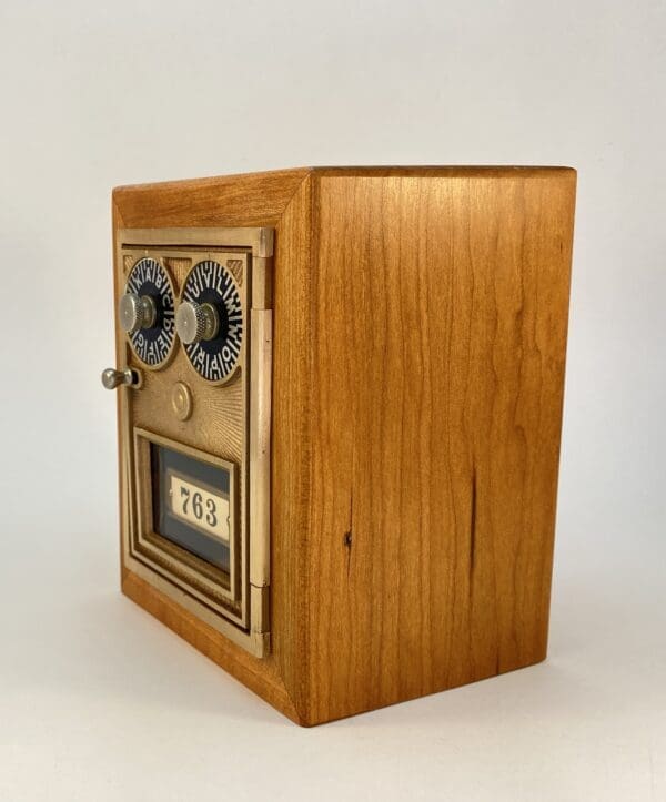 Wooden box with vintage mail slot.