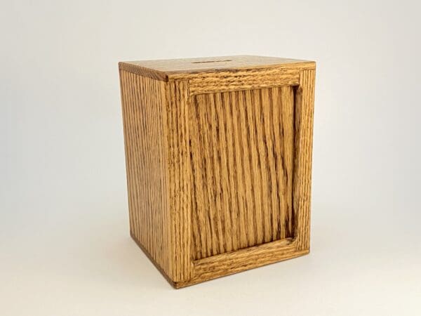 Wooden box with a slot on top.