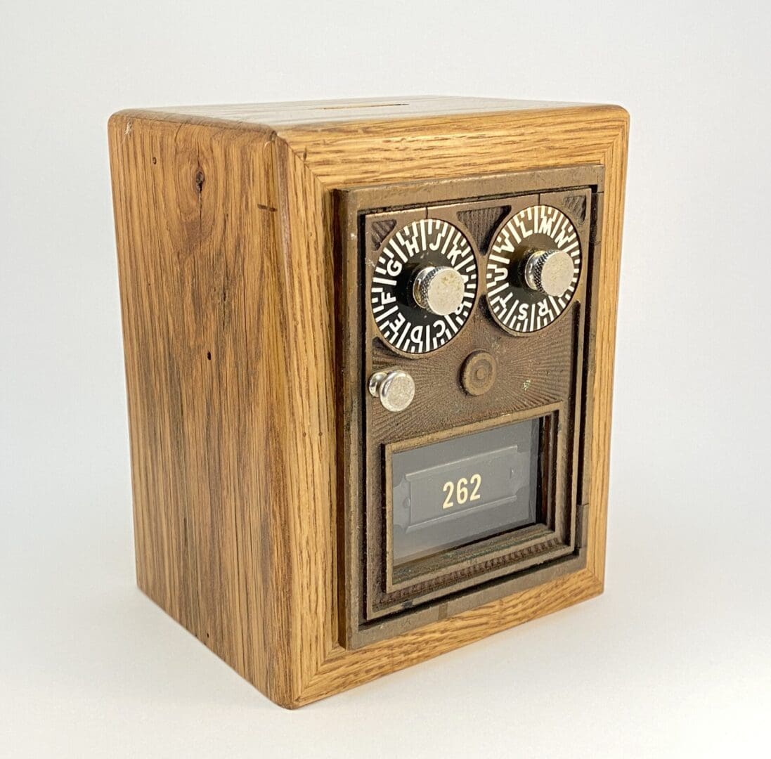 Wooden box with dials and numbered display.