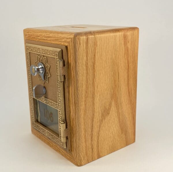 Wooden decorative money box with a lock.