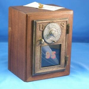 A wooden box with a clock on top of it.