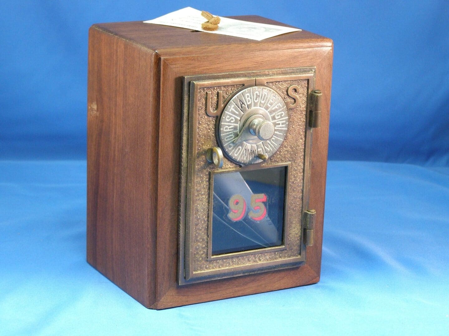 A wooden box with a clock on top of it.