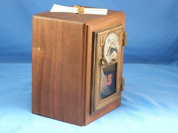 Antique wooden US mailbox with lock.