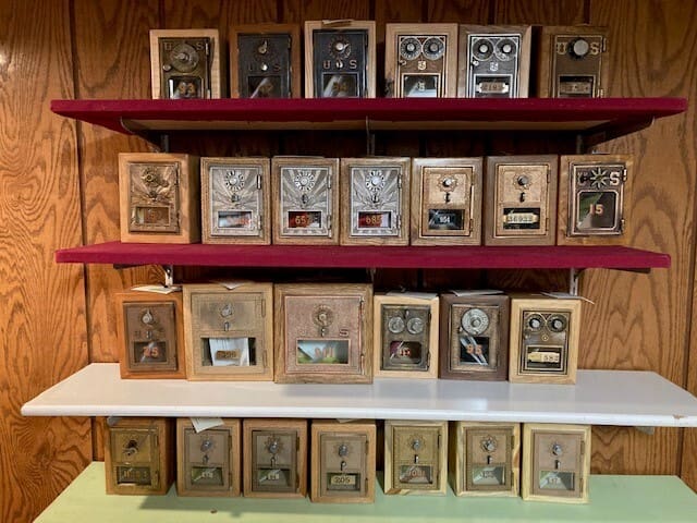 A shelf with many different boxes of faces