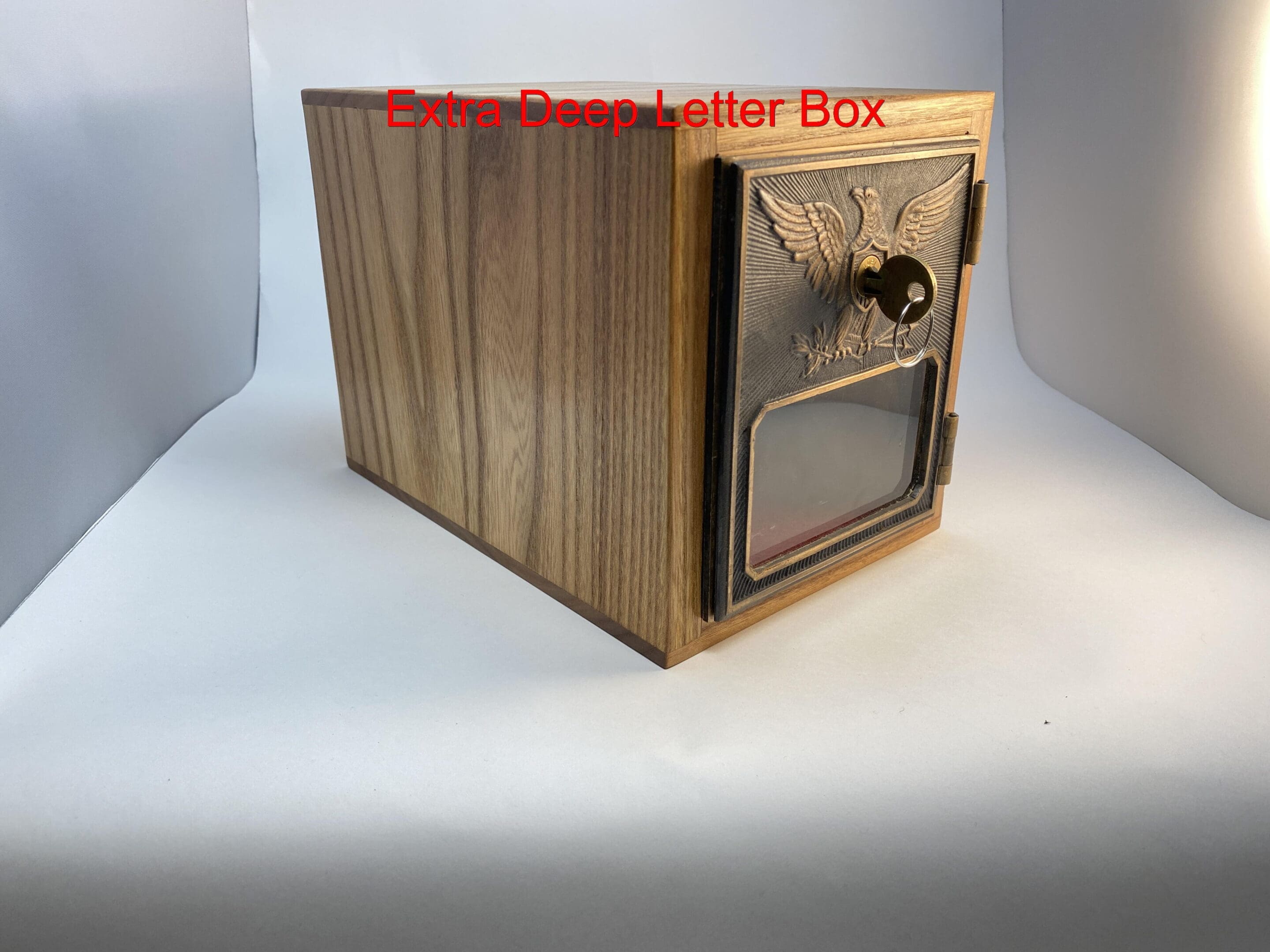 A wooden box with a metal door on top of it.