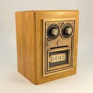 Wooden box with gold-tone mailbox door.