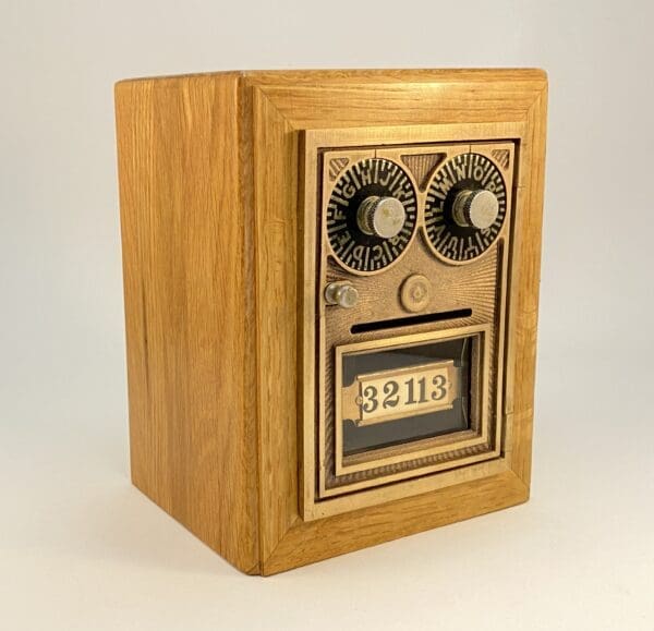 Wooden box with gold-tone mailbox door.