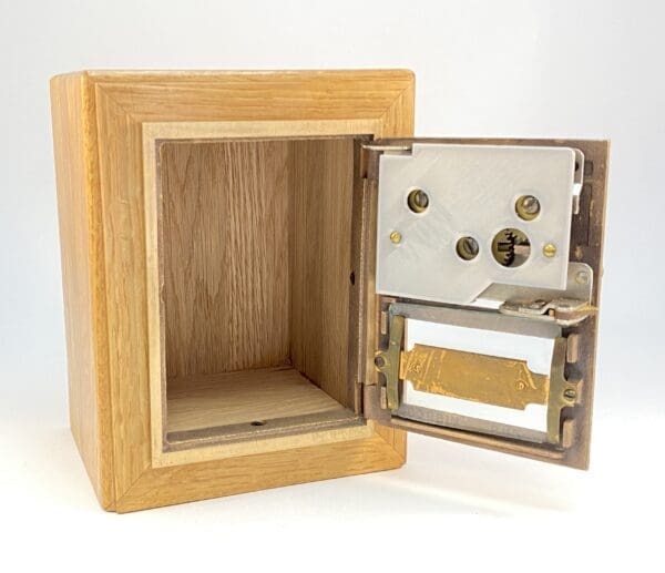 Open wooden box with metal lock.