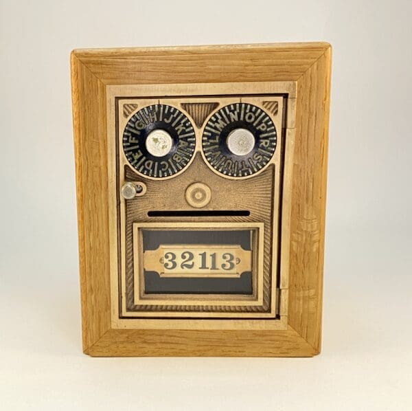 Wooden mailbox with combination lock.