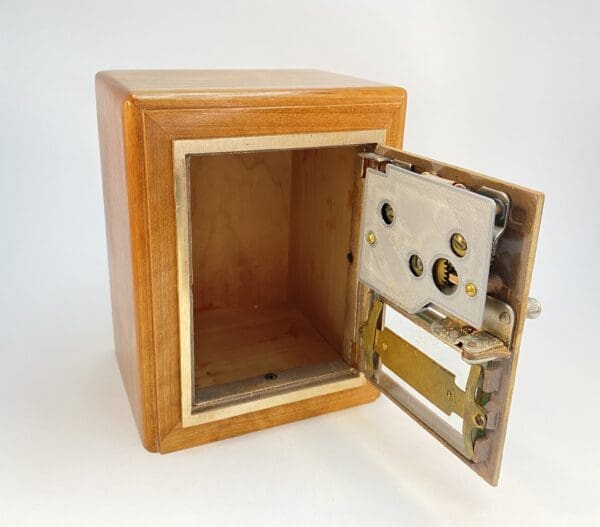 Wooden box with metal lock mechanism open.