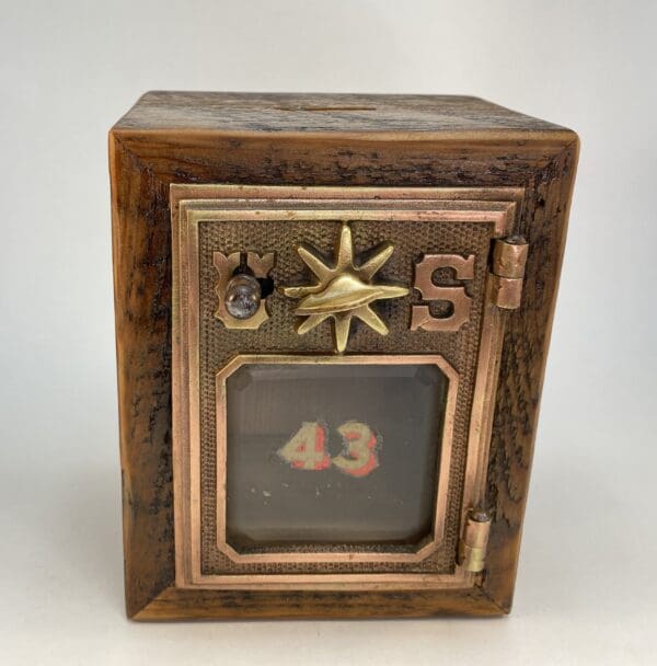 Vintage wooden box with numbered display.