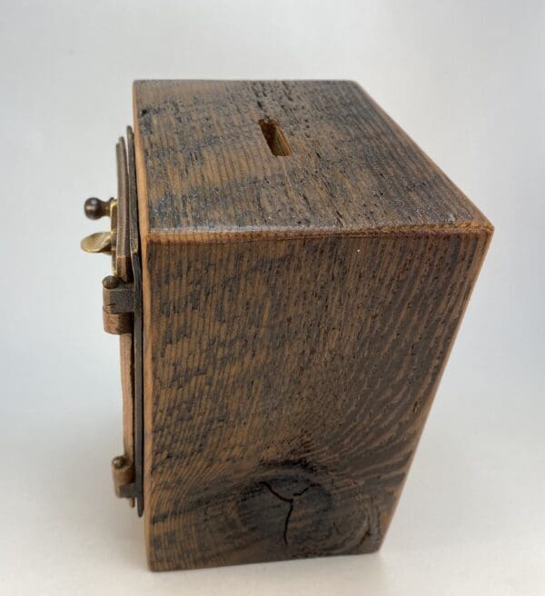 Wooden box with a slot on top.