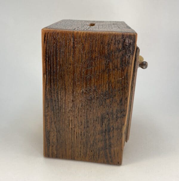 Wooden box with a textured surface.