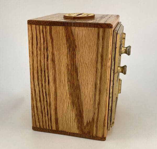 Wooden box with a metal lock mechanism.