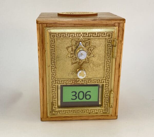 Decorative safe with number 306 displayed.